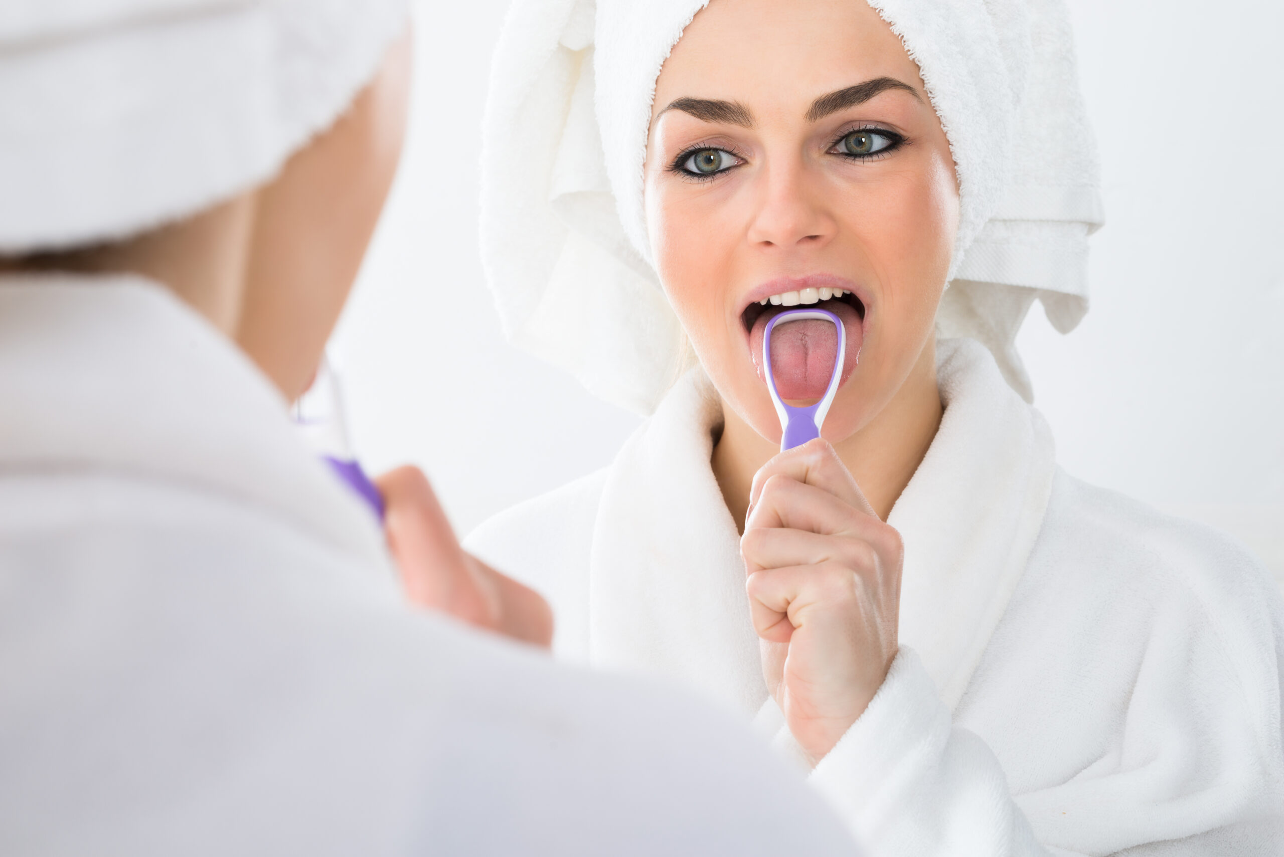 Should I Be Using a Tongue Scraper? | 68372 Dentist